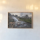 Cirque of the Towers Waterfall by Alan Majchrowicz. shown as a paper print in a natural frame. Available as a archival giclee rolled canvas, fine art paper, or poster print. SKU 84029i.
