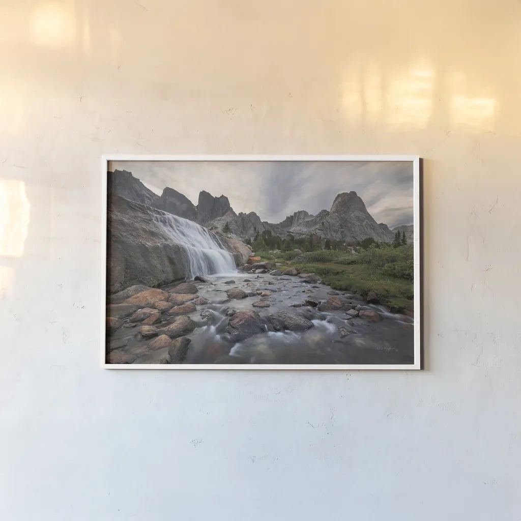 Cirque of the Towers Waterfall by Alan Majchrowicz. shown as a paper print in a white frame. Available as a archival giclee rolled canvas, fine art paper, or poster print. SKU 84029i.