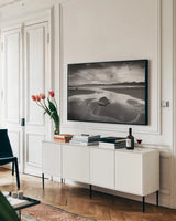 Clearing Storm on Washington Coast II by Alan Majchrowicz. shown as a framed stretched canvas in a living room above a console. Available as a archival giclee rolled canvas, fine art paper, or poster print. SKU 43953i.