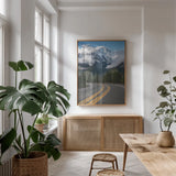Colonial Peak and North Cascades Highway by Alan Majchrowicz. shown as a print in a natural wood frame in a dining room. Available as a archival giclee rolled canvas, fine art paper, or poster print. SKU 101143h.