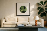 Corn Lily Circle I by Alan Majchrowicz. Displayed in a glass frame with matte in a clean modern living room. Available as an archival giclee rolled canvas, fine art paper, or poster print. SKU 66121a.