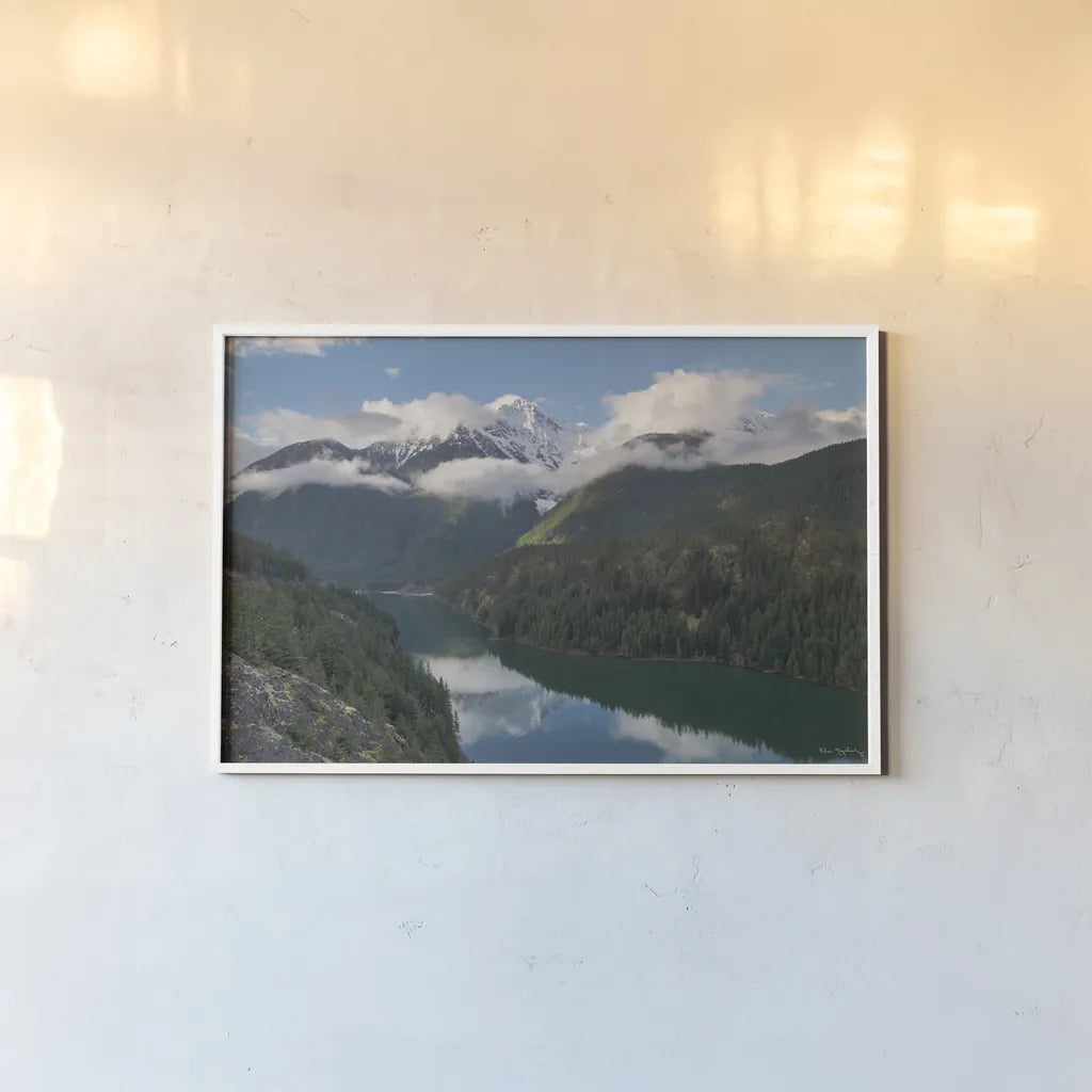 Diablo Lake and Colonial Peak by Alan Majchrowicz. shown as a paper print in a white frame. Available as a archival giclee rolled canvas, fine art paper, or poster print. SKU 101145i.