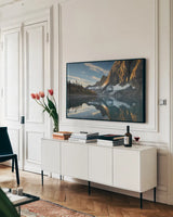Floe Lake Reflection III by Alan Majchrowicz. shown as a framed stretched canvas in a living room above a console. Available as a archival giclee rolled canvas, fine art paper, or poster print. SKU 28100i.