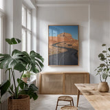 Goblin Valley State Park Road by Alan Majchrowicz. shown as a print in a natural wood frame in a dining room. Available as a archival giclee rolled canvas, fine art paper, or poster print. SKU 81526h.