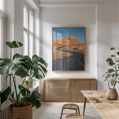 Goblin Valley State Park Road by Alan Majchrowicz. shown as a print in a natural wood frame in a dining room. Available as a archival giclee rolled canvas, fine art paper, or poster print. SKU 81526h.