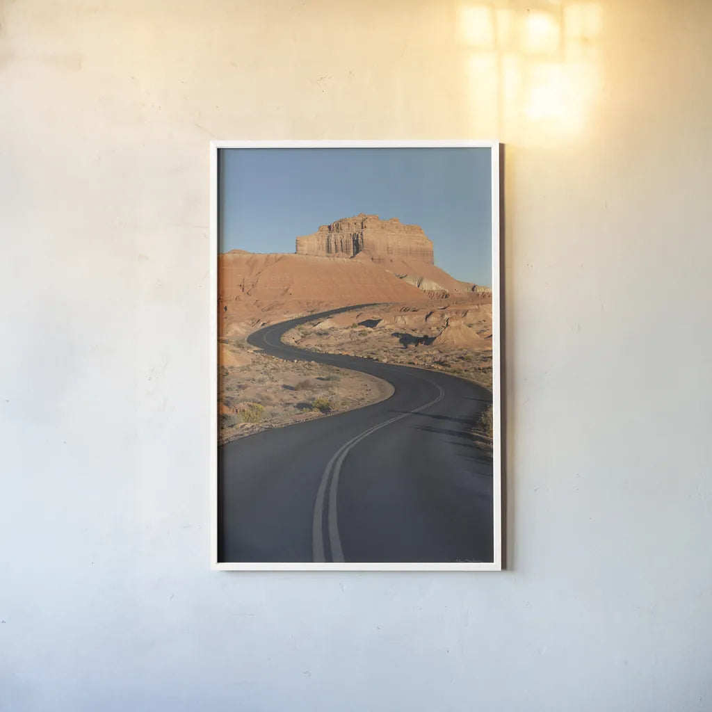 Goblin Valley State Park Road by Alan Majchrowicz. shown as a paper print in a white frame. Available as a archival giclee rolled canvas, fine art paper, or poster print. SKU 81526h.