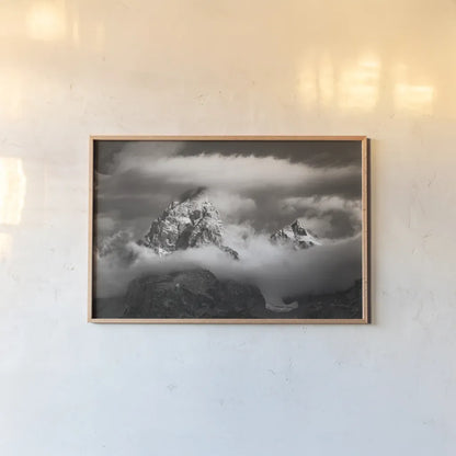 Grand Teton Clouds by Alan Majchrowicz. shown as a paper print in a natural frame. Available as a archival giclee rolled canvas, fine art paper, or poster print. SKU 64540i.