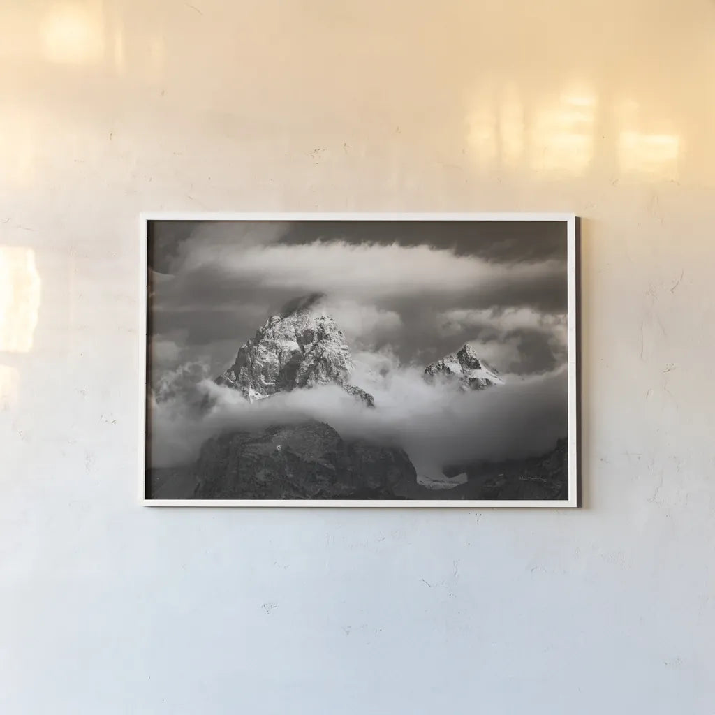 Grand Teton Clouds by Alan Majchrowicz. shown as a paper print in a white frame. Available as a archival giclee rolled canvas, fine art paper, or poster print. SKU 64540i.