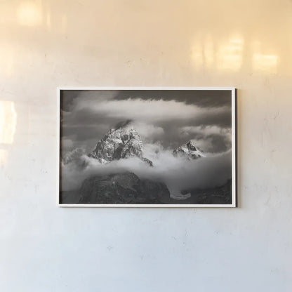 Grand Teton Clouds by Alan Majchrowicz. shown as a paper print in a white frame. Available as a archival giclee rolled canvas, fine art paper, or poster print. SKU 64540i.