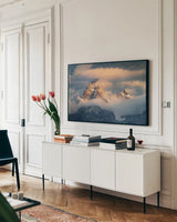 Grand Teton Clouds Color by Alan Majchrowicz. shown as a framed stretched canvas in a living room above a console. Available as a archival giclee rolled canvas, fine art paper, or poster print. SKU 78028i.