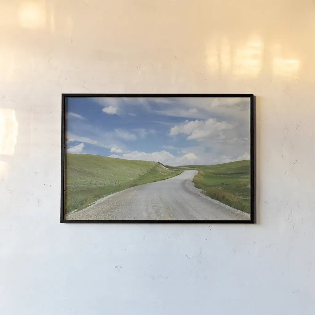 Gravel Road Near Choteau Montana I by Alan Majchrowicz. shown as a paper print in a black flame. Available as a archival giclee rolled canvas, fine art paper, or poster print. SKU 62460i.