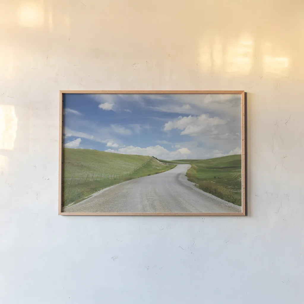 Gravel Road Near Choteau Montana I by Alan Majchrowicz. shown as a paper print in a natural frame. Available as a archival giclee rolled canvas, fine art paper, or poster print. SKU 62460i.