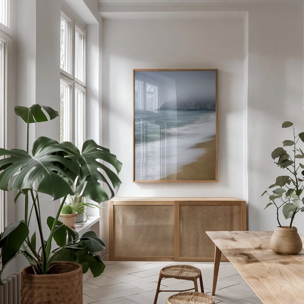 Gray Whale Cove by Alan Majchrowicz. shown as a print in a natural wood frame in a dining room. Available as a archival giclee rolled canvas, fine art paper, or poster print. SKU 46107h.