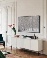 Grove of Aspen Trees in Winter by Alan Majchrowicz. shown as a framed stretched canvas in a living room above a console. Available as a archival giclee rolled canvas, fine art paper, or poster print. SKU 43902i.