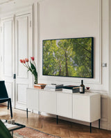 Hardwood Forest Canopy III by Alan Majchrowicz. shown as a framed stretched canvas in a living room above a console. Available as a archival giclee rolled canvas, fine art paper, or poster print. SKU 52769i.