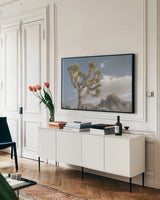 Joshua Tree National Park III by Alan Majchrowicz. shown as a framed stretched canvas in a living room above a console. Available as a archival giclee rolled canvas, fine art paper, or poster print. SKU 61457i.