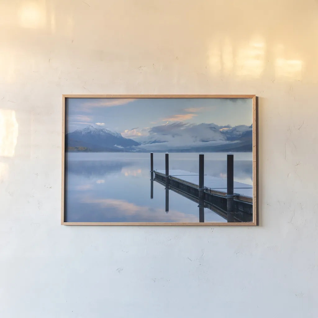 Lake McDonald Dock by Alan Majchrowicz. shown as a paper print in a natural frame. Available as a archival giclee rolled canvas, fine art paper, or poster print. SKU 43057i.
