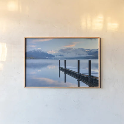 Lake McDonald Dock by Alan Majchrowicz. shown as a paper print in a natural frame. Available as a archival giclee rolled canvas, fine art paper, or poster print. SKU 43057i.