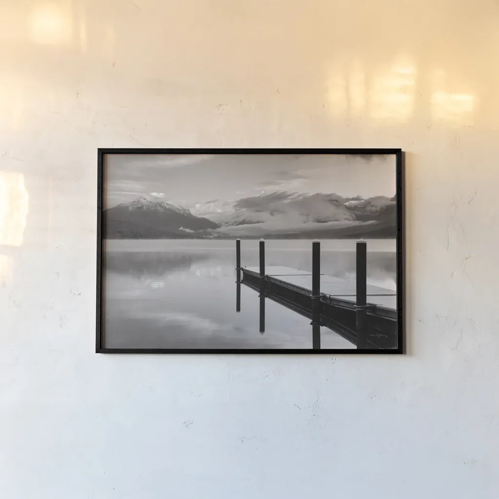 Lake McDonald Dock BW by Alan Majchrowicz. shown as a paper print in a black flame. Available as a archival giclee rolled canvas, fine art paper, or poster print. SKU 50227i.