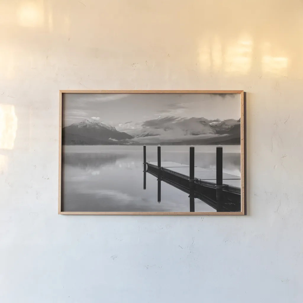 Lake McDonald Dock BW by Alan Majchrowicz. shown as a paper print in a natural frame. Available as a archival giclee rolled canvas, fine art paper, or poster print. SKU 50227i.