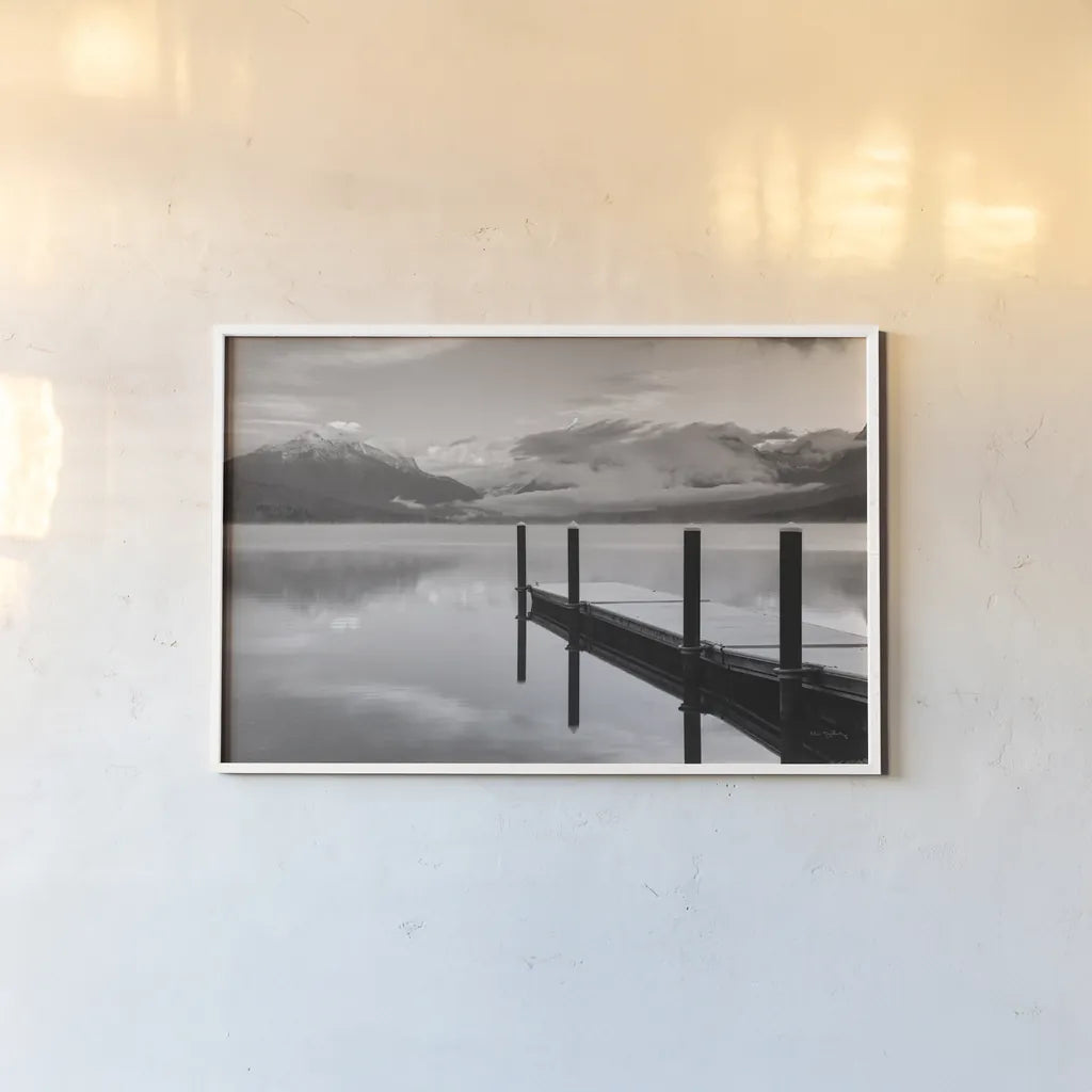 Lake McDonald Dock BW by Alan Majchrowicz. shown as a paper print in a white frame. Available as a archival giclee rolled canvas, fine art paper, or poster print. SKU 50227i.