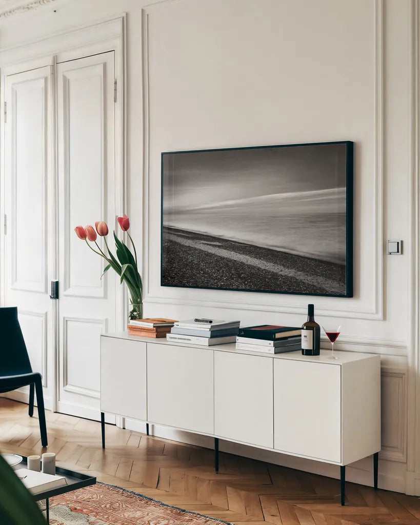 Lake Superior Beach III BW by Alan Majchrowicz. shown as a framed stretched canvas in a living room above a console. Available as a archival giclee rolled canvas, fine art paper, or poster print. SKU 50401i.