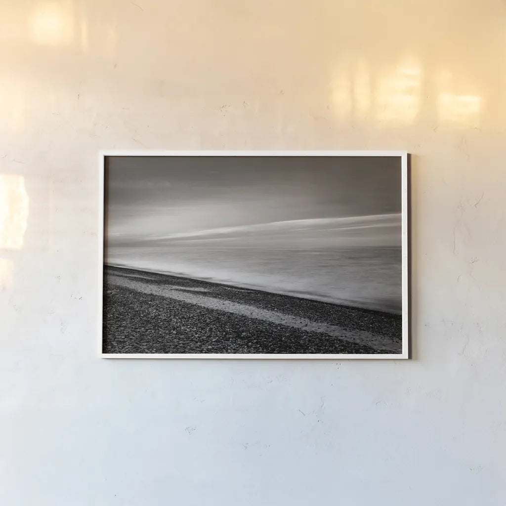 Lake Superior Beach III BW by Alan Majchrowicz. shown as a paper print in a white frame. Available as a archival giclee rolled canvas, fine art paper, or poster print. SKU 50401i.