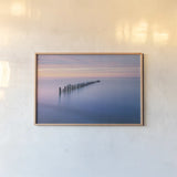 Lake Superior Old Pier IV by Alan Majchrowicz. shown as a paper print in a natural frame. Available as a archival giclee rolled canvas, fine art paper, or poster print. SKU 50406i.
