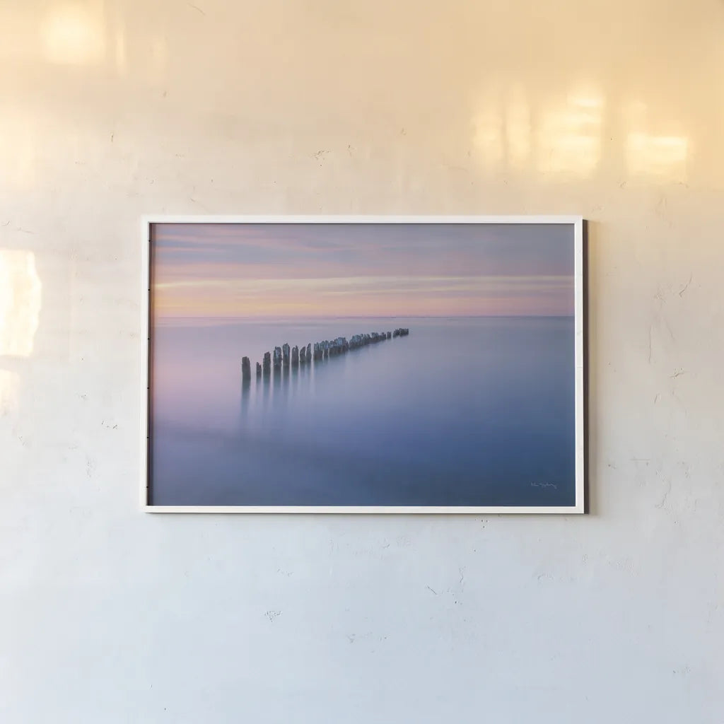 Lake Superior Old Pier IV by Alan Majchrowicz. shown as a paper print in a white frame. Available as a archival giclee rolled canvas, fine art paper, or poster print. SKU 50406i.
