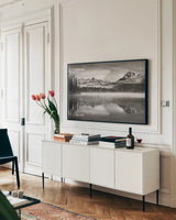 Little Redfish Lake Morning I by Alan Majchrowicz. shown as a framed stretched canvas in a living room above a console. Available as a archival giclee rolled canvas, fine art paper, or poster print. SKU 64556i.