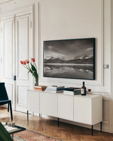 Little Redfish Lake Morning II by Alan Majchrowicz. shown as a framed stretched canvas in a living room above a console. Available as a archival giclee rolled canvas, fine art paper, or poster print. SKU 64557i.