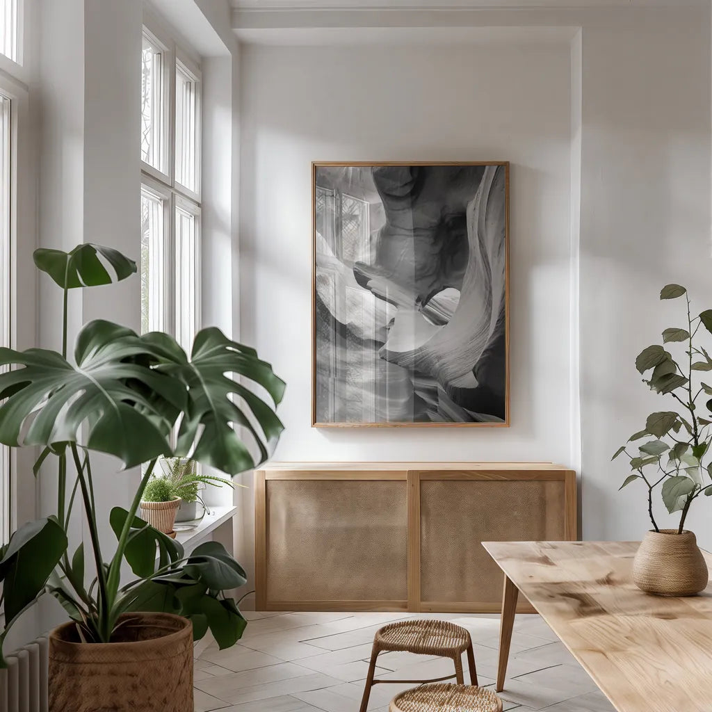 Lower Antelope Canyon IX BW by Alan Majchrowicz. shown as a print in a natural wood frame in a dining room. Available as a archival giclee rolled canvas, fine art paper, or poster print. SKU 53662h.