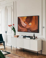 Lower Antelope Canyon X by Alan Majchrowicz. shown as a framed stretched canvas in a living room above a console. Available as a archival giclee rolled canvas, fine art paper, or poster print. SKU 53279i.