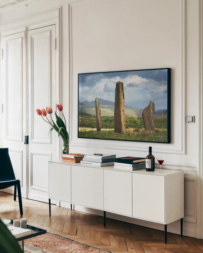 Machrie Moor Standing Stones by Alan Majchrowicz. shown as a framed stretched canvas in a living room above a console. Available as a archival giclee rolled canvas, fine art paper, or poster print. SKU 84033i.