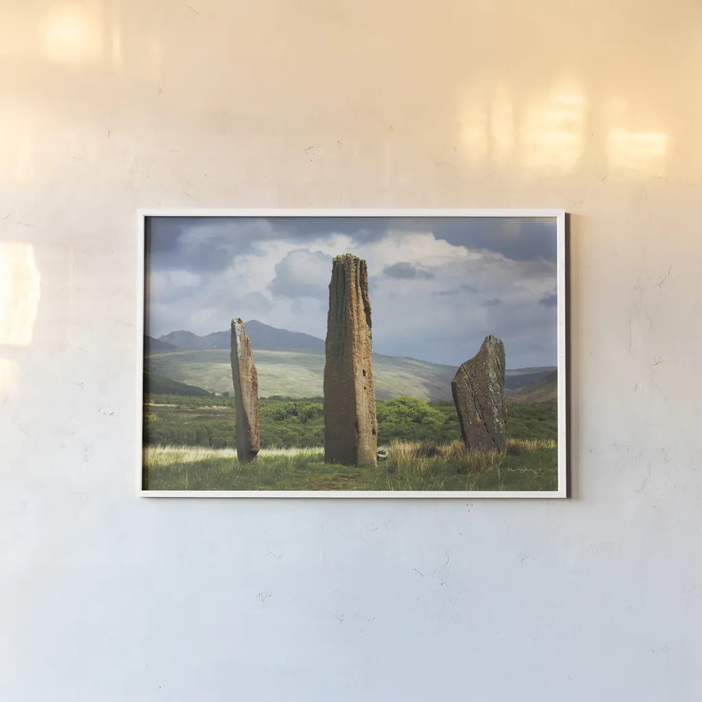 Machrie Moor Standing Stones by Alan Majchrowicz. shown as a paper print in a white frame. Available as a archival giclee rolled canvas, fine art paper, or poster print. SKU 84033i.