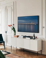 Mackinac Bridge by Alan Majchrowicz. shown as a framed stretched canvas in a living room above a console. Available as a archival giclee rolled canvas, fine art paper, or poster print. SKU 50603i.