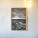 Makoshika Badlands by Alan Majchrowicz. shown as a paper print in a natural frame. Available as a archival giclee rolled canvas, fine art paper, or poster print. SKU 88890h.