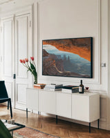 Mesa Arch Canyonlands National Park by Alan Majchrowicz. shown as a framed stretched canvas in a living room above a console. Available as a archival giclee rolled canvas, fine art paper, or poster print. SKU 80815i.