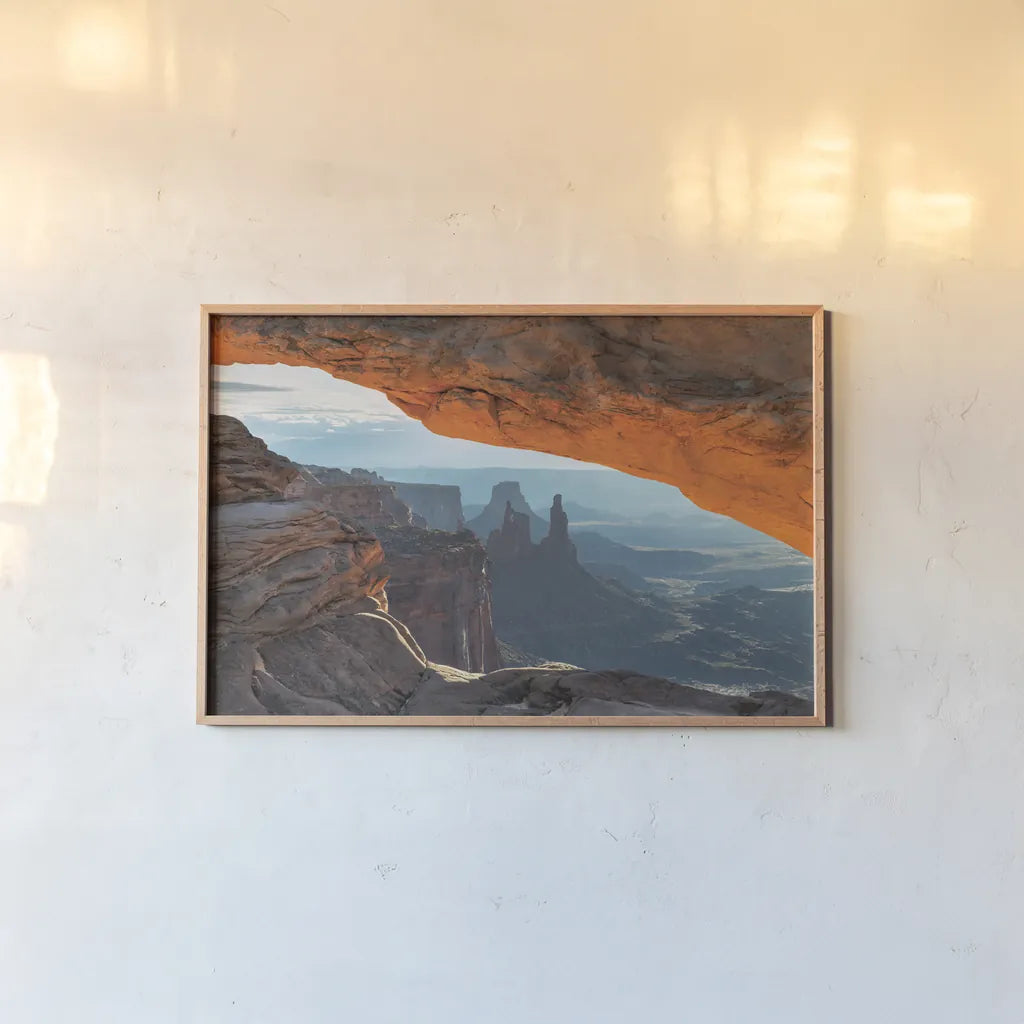 Mesa Arch Canyonlands National Park by Alan Majchrowicz. shown as a paper print in a natural frame. Available as a archival giclee rolled canvas, fine art paper, or poster print. SKU 80815i.