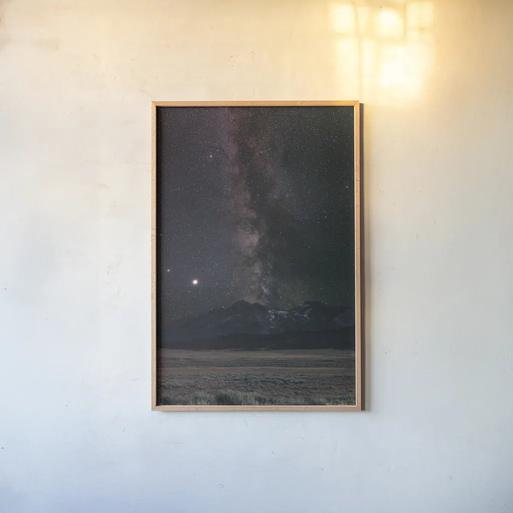 Milky Way in Sawtooth Mountains by Alan Majchrowicz. shown as a paper print in a natural frame. Available as a archival giclee rolled canvas, fine art paper, or poster print. SKU 68097h.