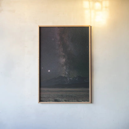 Milky Way in Sawtooth Mountains by Alan Majchrowicz. shown as a paper print in a natural frame. Available as a archival giclee rolled canvas, fine art paper, or poster print. SKU 68097h.