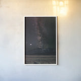 Milky Way in Sawtooth Mountains by Alan Majchrowicz. shown as a paper print in a white frame. Available as a archival giclee rolled canvas, fine art paper, or poster print. SKU 68097h.