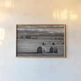 Montana Hay Bales by Alan Majchrowicz. shown as a paper print in a natural frame. Available as a archival giclee rolled canvas, fine art paper, or poster print. SKU 88894i.