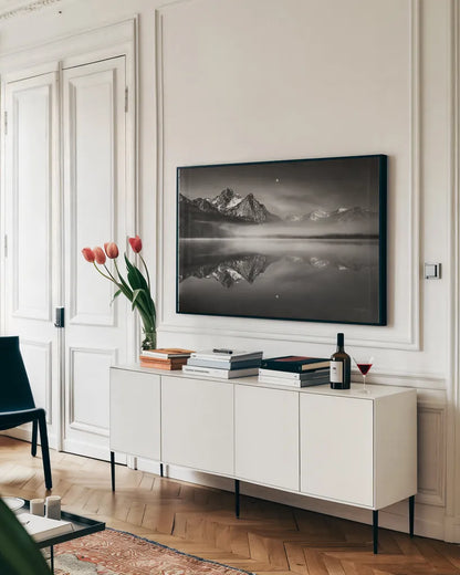 Moonset on McGown Peak by Alan Majchrowicz. shown as a framed stretched canvas in a living room above a console. Available as a archival giclee rolled canvas, fine art paper, or poster print. SKU 64541i.