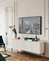 North Cascades in Winter I by Alan Majchrowicz. shown as a framed stretched canvas in a living room above a console. Available as a archival giclee rolled canvas, fine art paper, or poster print. SKU 60621i.