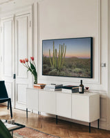Organ Pipe Cactus at Dusk by Alan Majchrowicz. shown as a framed stretched canvas in a living room above a console. Available as a archival giclee rolled canvas, fine art paper, or poster print. SKU 84035i.