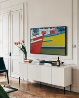 Orkney Fishing Boats by Alan Majchrowicz. shown as a framed stretched canvas in a living room above a console. Available as a archival giclee rolled canvas, fine art paper, or poster print. SKU 53744i.