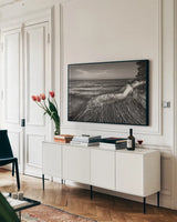 Pictured Rocks Michigan II BW by Alan Majchrowicz. shown as a framed stretched canvas in a living room above a console. Available as a archival giclee rolled canvas, fine art paper, or poster print. SKU 50394i.