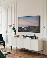 Rugged Coast Along Wild Pacific Trail by Alan Majchrowicz. shown as a framed stretched canvas in a living room above a console. Available as a archival giclee rolled canvas, fine art paper, or poster print. SKU 86352i.