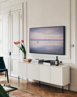 Sailboat in Bellingham Bay I Vignette by Alan Majchrowicz. shown as a framed stretched canvas in a living room above a console. Available as a archival giclee rolled canvas, fine art paper, or poster print. SKU 68923i.
